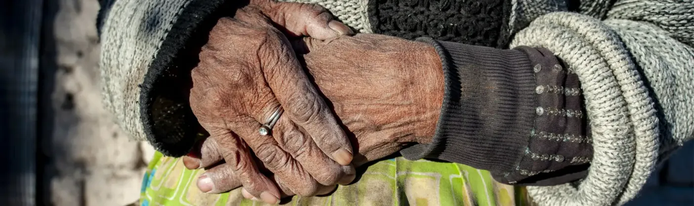 Hands of an elderly person in need