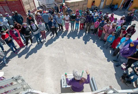 Members of the community learn how to operate their new stoves